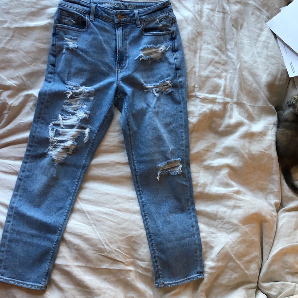 Jeans , blue, starchy , distressed . Size M woman